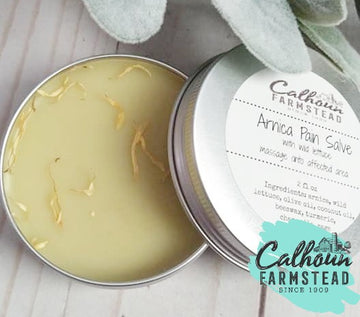 Arnica pain relief salve. Made with dried herbs of arnica and wild lettuce. Use for muscle and joint pains. 2oz tin made by Calhoun Farm.