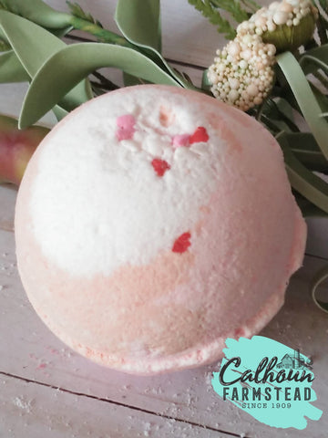 Handmade bath bombs. With pink and red heart sprinkles. Fizzy for bath time. Kids bath, relaxing bath, and self-care. Calhoun Farm located in Falls Creek PA.