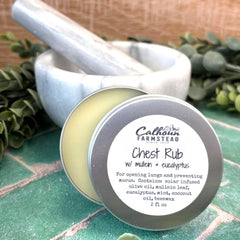 Chest Rub container with label on a textured surface with greenery