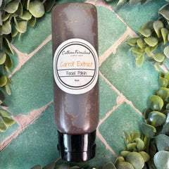 Facial polish bottle with label on a green tiled background. Natural facial care.
