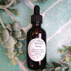 Bottle of Calhoun Extract Hawthorn Extract with a dropper on a green leafy background. Herbal apothecary. Herb store.