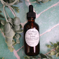 Bottle of Nettle Leaf Extract with a dropper on a green background with leaves.