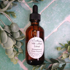 Bottle of Cathcart Wild Lettuce Extract with a label on a green leafy background