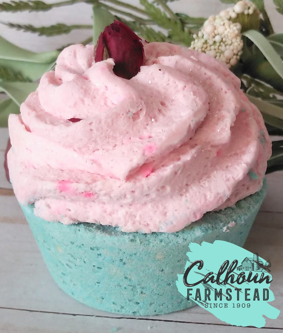 Cupcake bath bomb. Blue cake with pink icing, topped with a natural dried rose. Make bath time special and pamper yourself with this relaxing scent. Perfect for a cupcake themed party, baby shower, or bridal shower favor.