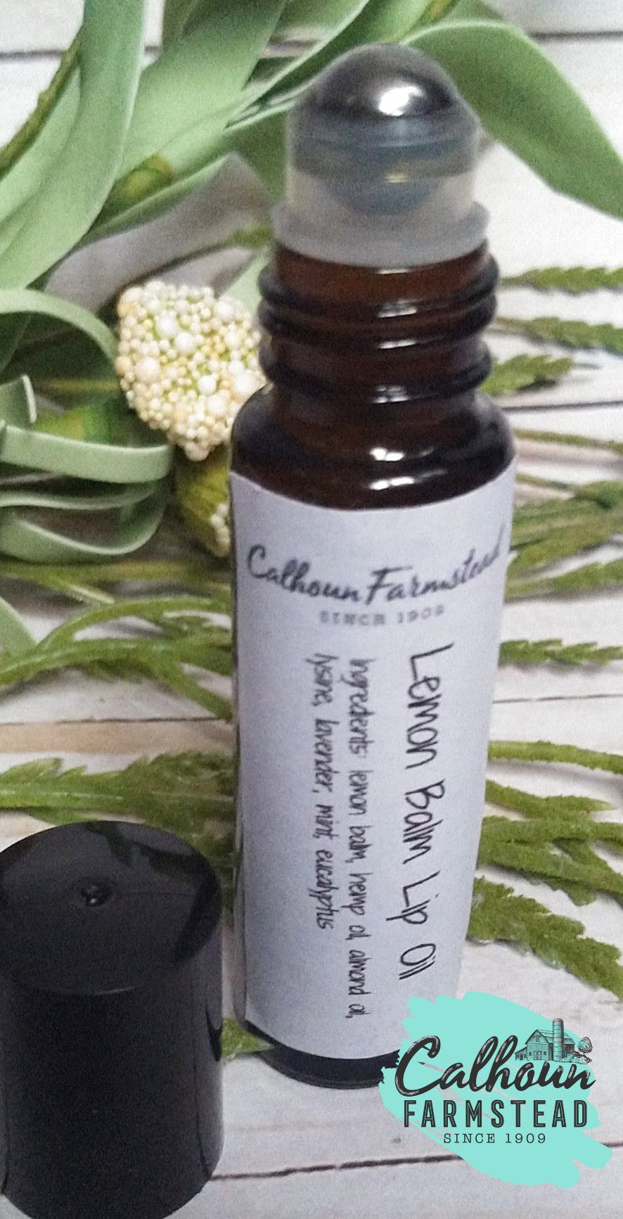 lemon balm lip oil with lysine roller bottle. for healing lip blisters, cold sores, and lip herpes.